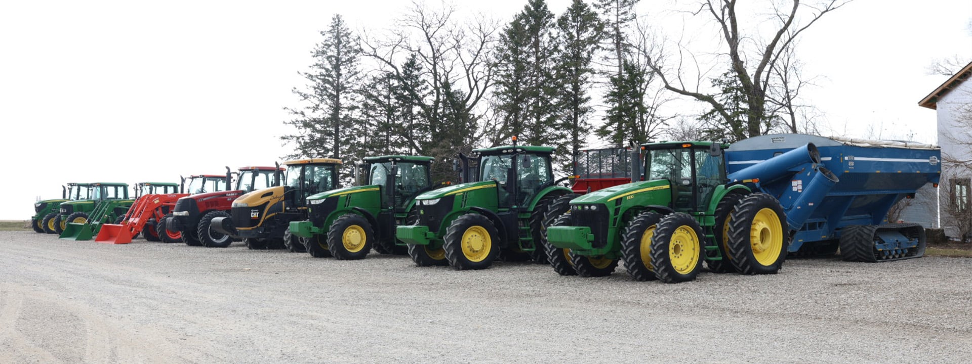 Lineup of Case and John Deere tractors