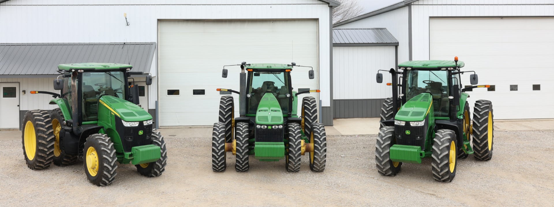 Side view of the three John Deere Tractors