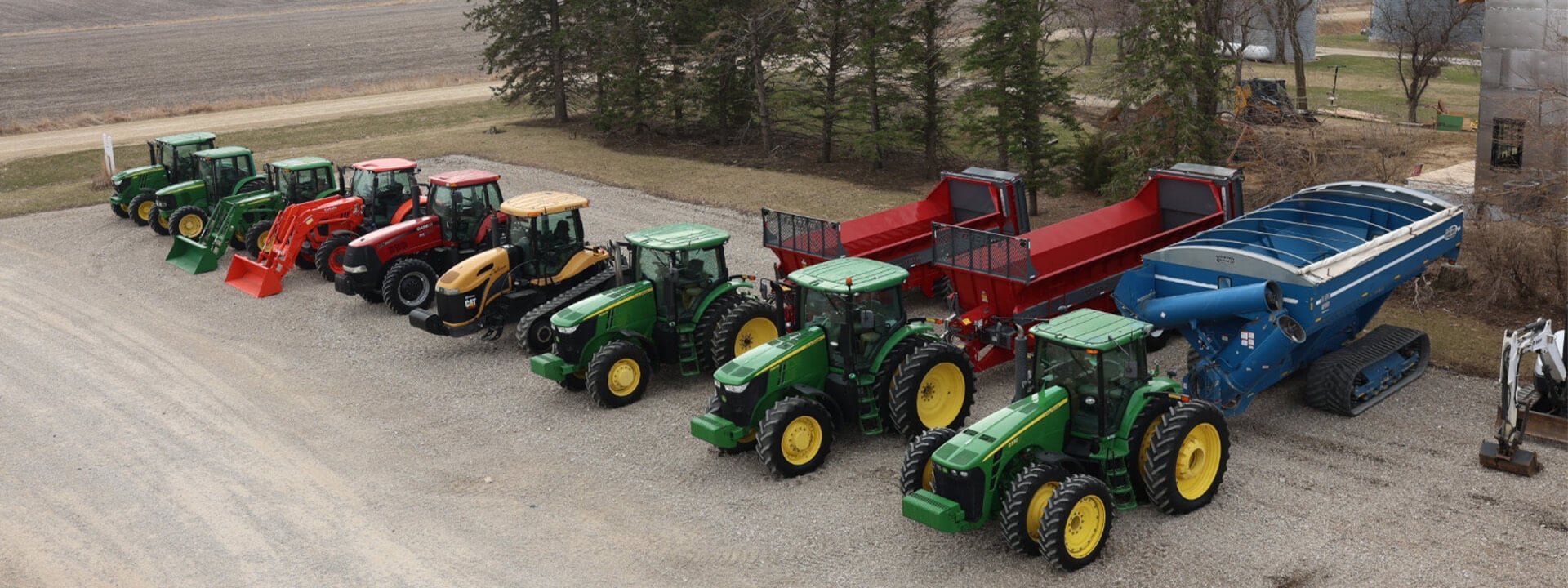 Lineup of Case and John Deere tractors top view