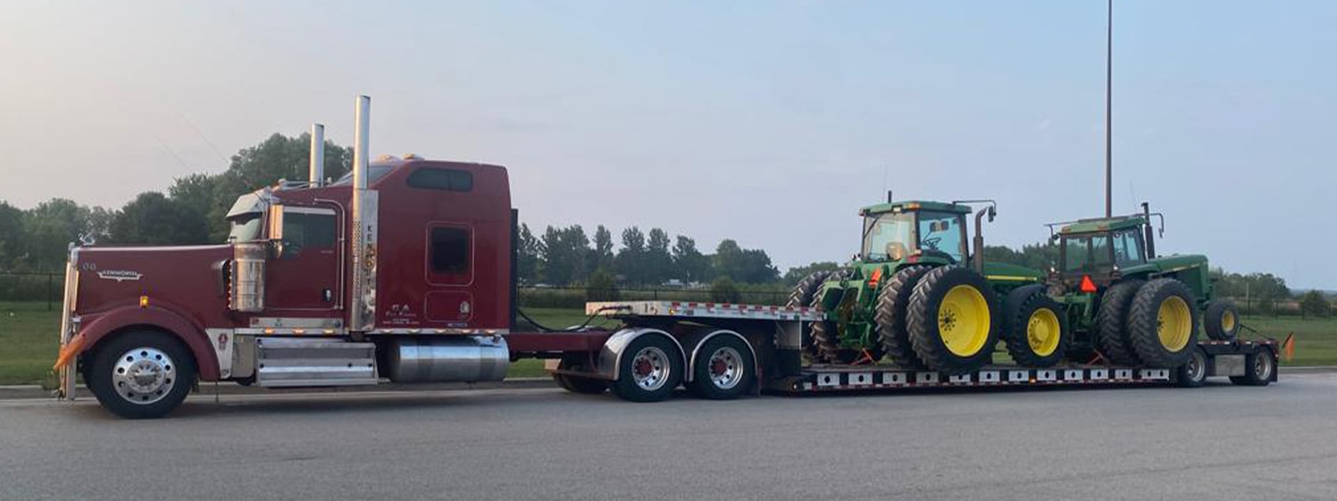 Semi Carrying John Deere Tractor